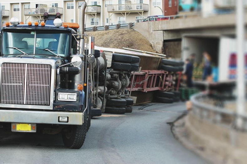 A tipped over tractor trailer after a truck accident.