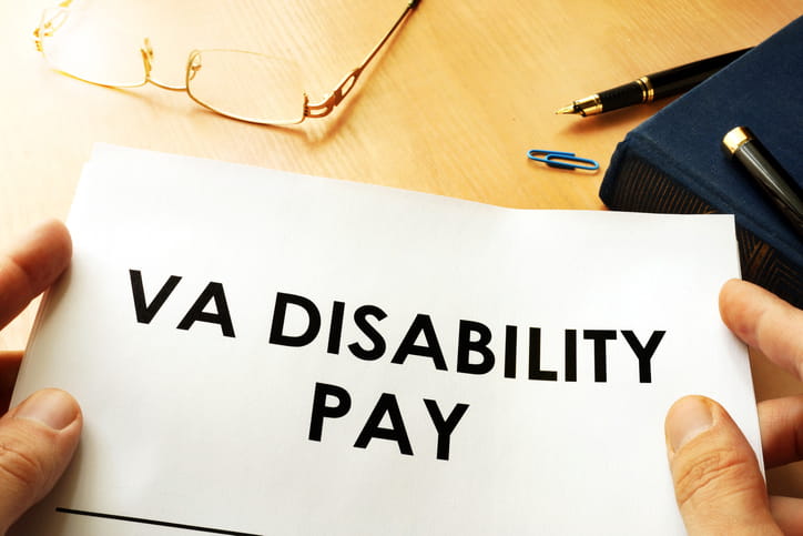 A paper that reads "VA Disability Pay."